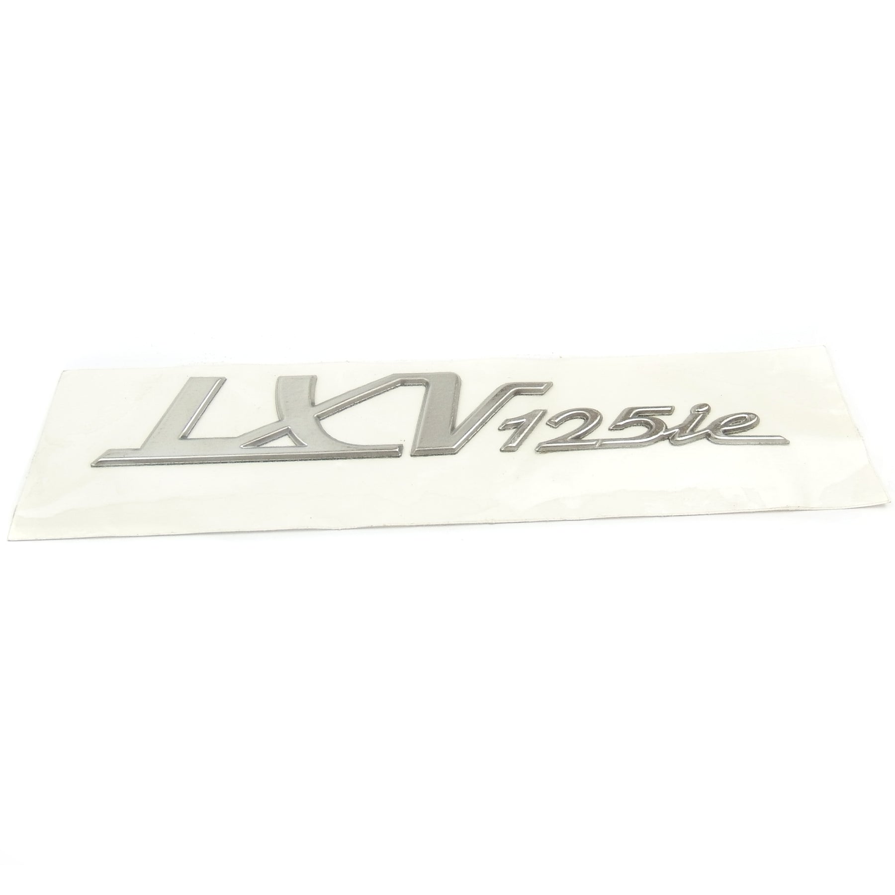 Stick On Vespa Badge 14.2cm x 2.2cm Silver LXV 125ie